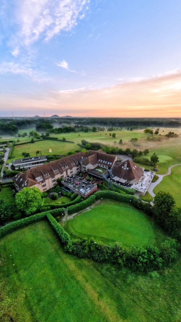 Aerial hotel and golf landscape